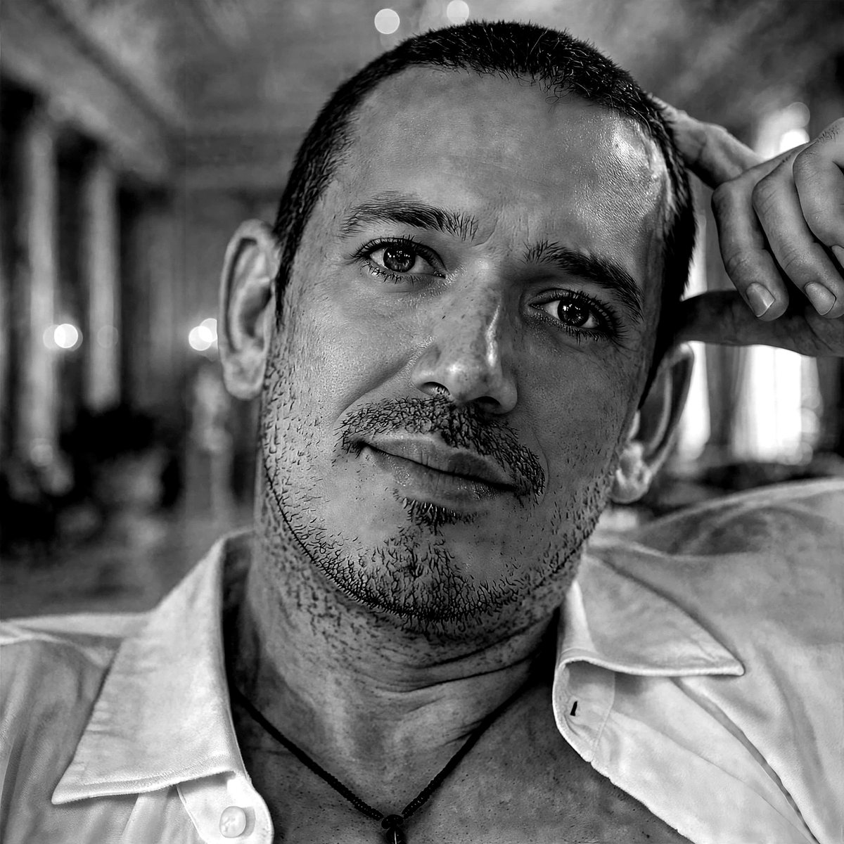 Anthony John Sissian, black-and-white portrait